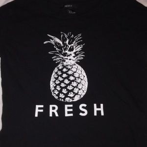 Black shirt with a pineapple and bold words